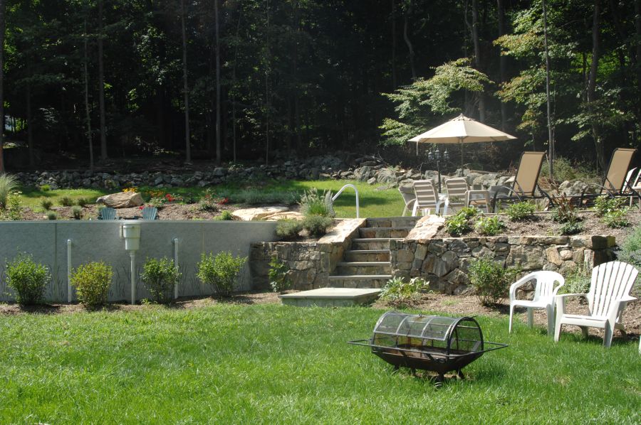 Above ground pool project with clean surrounding finish and backyard layout